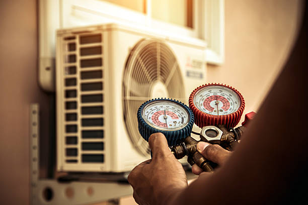 Professional Air Conditioning Service technician working in Sandy, OR